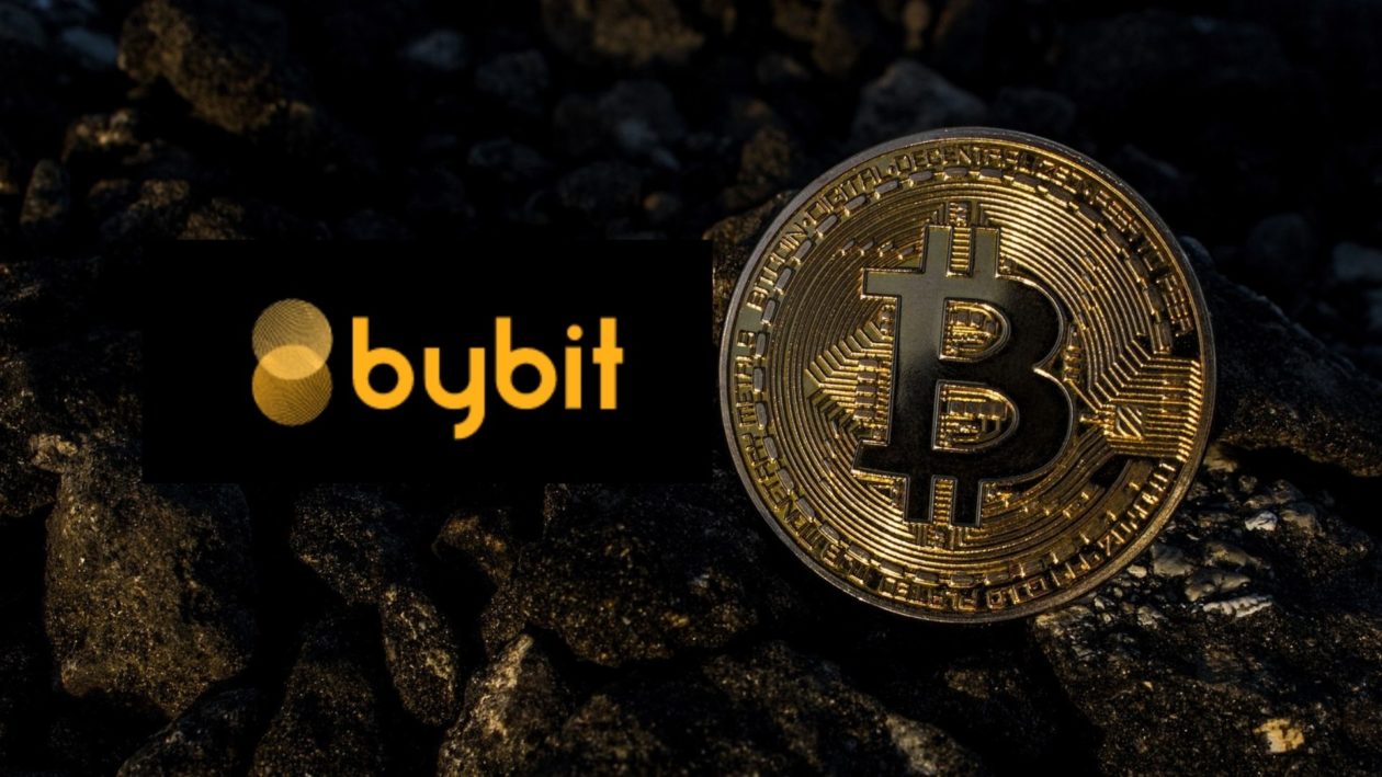 Bybit crypto exchange text in orange and a golden Bitcoin on a dark background